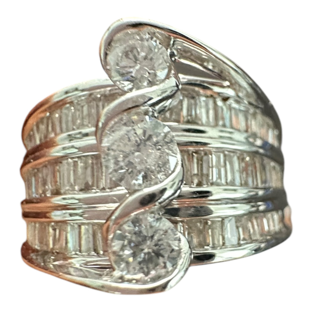 Contemporary 3-Stone 14kt gold 1.50ct baguette ring.