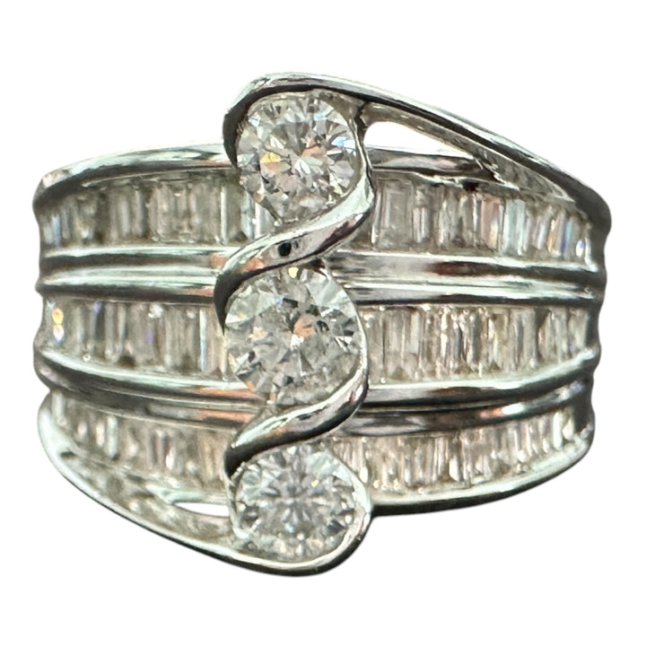 Contemporary 3-Stone 14kt gold 1.50ct baguette ring.