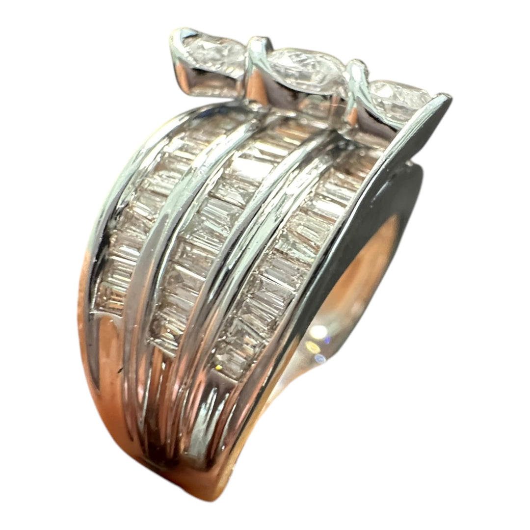 Contemporary 3-Stone 14kt gold 1.50ct baguette ring.