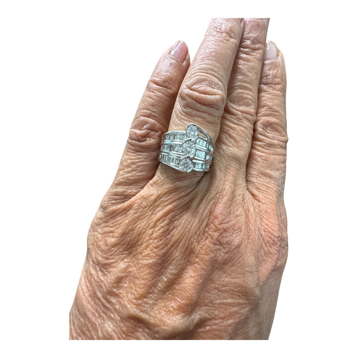 Contemporary 3-Stone 14kt gold 1.50ct baguette ring.