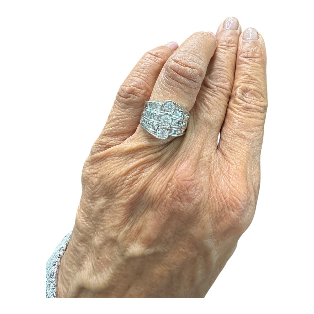 Contemporary 3-Stone 14kt gold 1.50ct baguette ring.