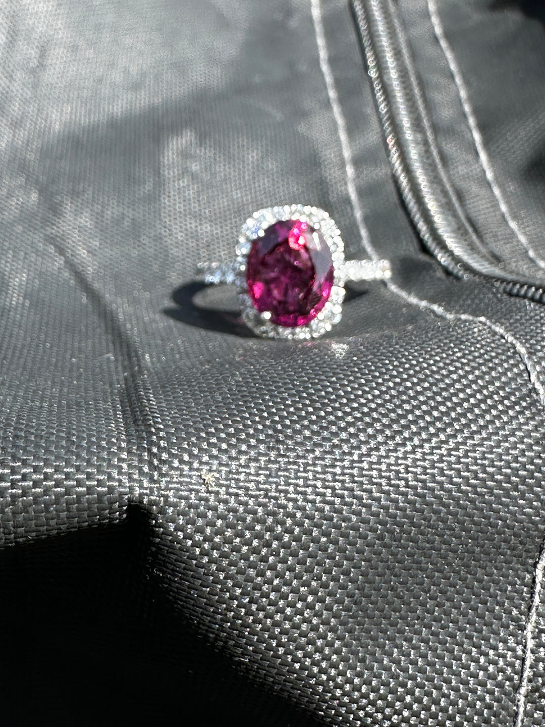 14 karat, 2 carat purple Tourmaline and diamond halo ring