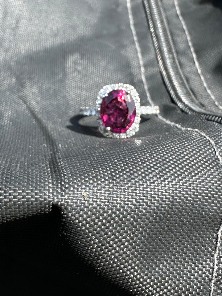 14 karat, 2 carat purple Tourmaline and diamond halo ring