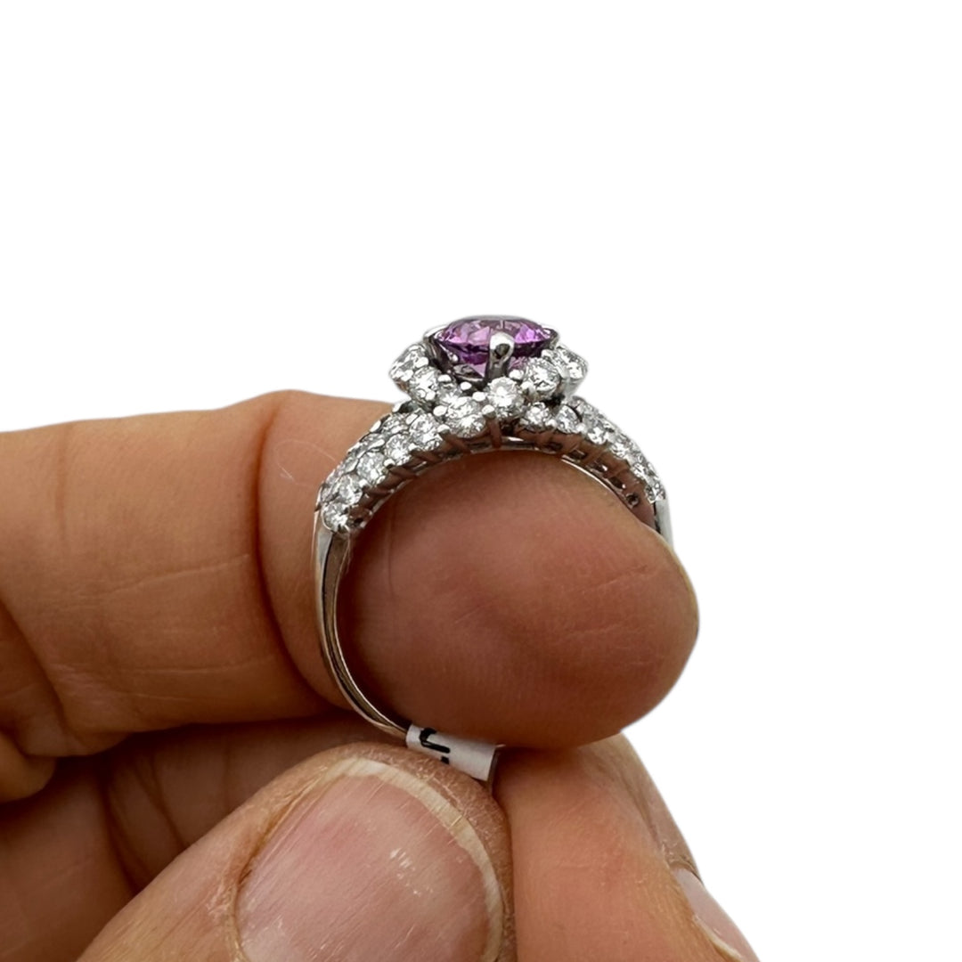 ￼ 14 karat white gold, pink, sapphire, and diamond Paved halo split shank ring