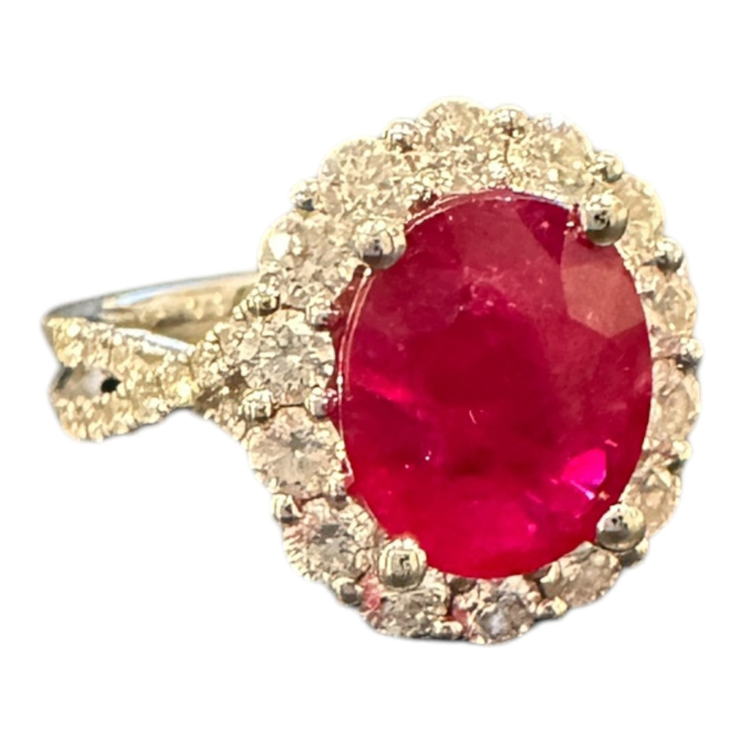 18 karat white gold, 3.58 ct ruby, and diamond halo ring.