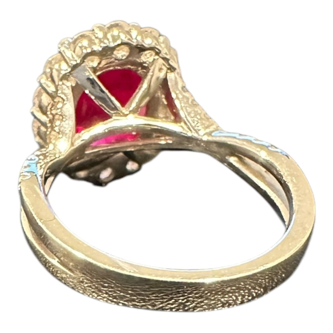 18 karat white gold, 3.58 ct ruby, and diamond halo ring.