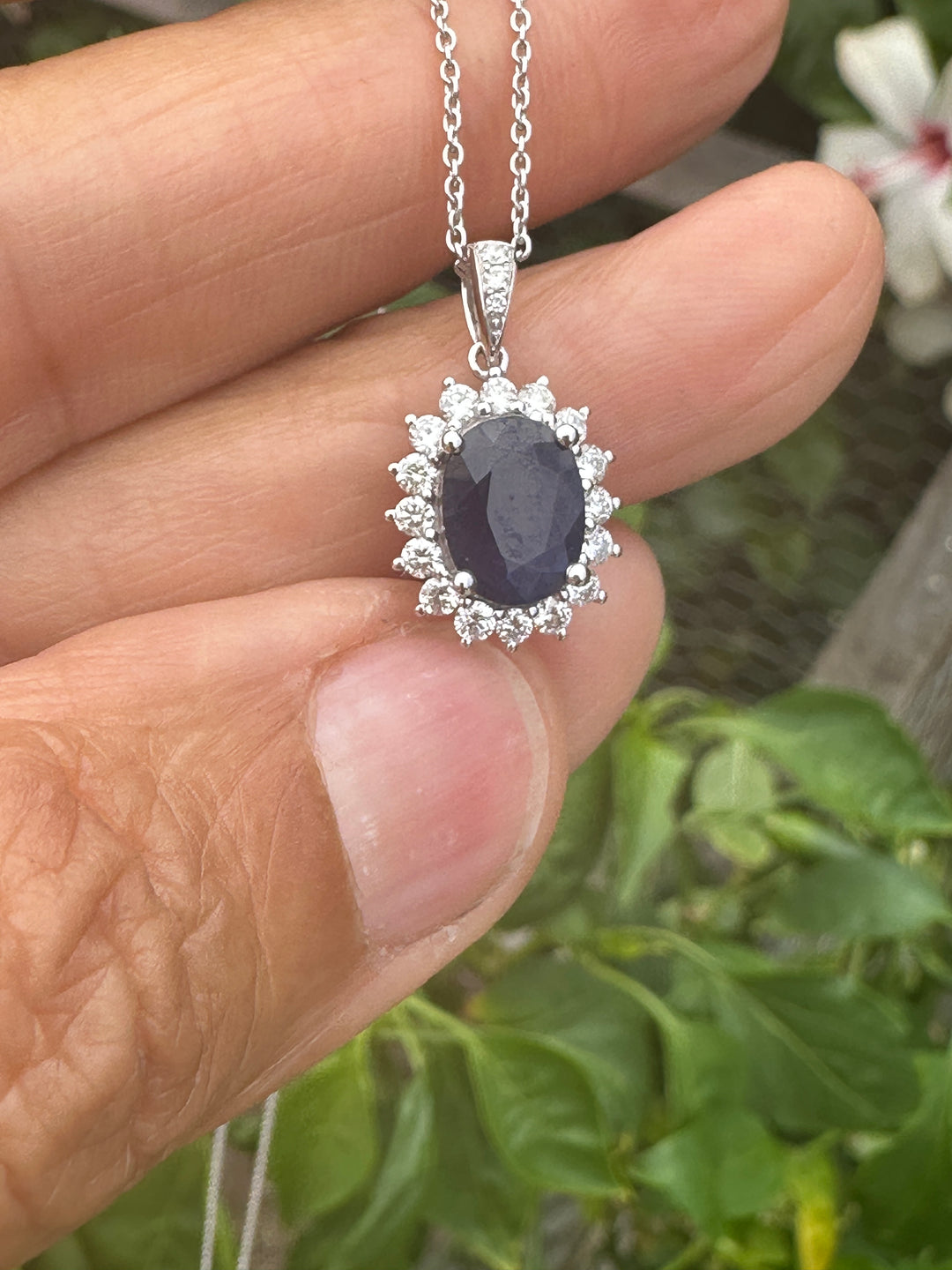 14 karat white gold 2.90 carat sapphire and Diamond Halo, pendant, and chain ￼