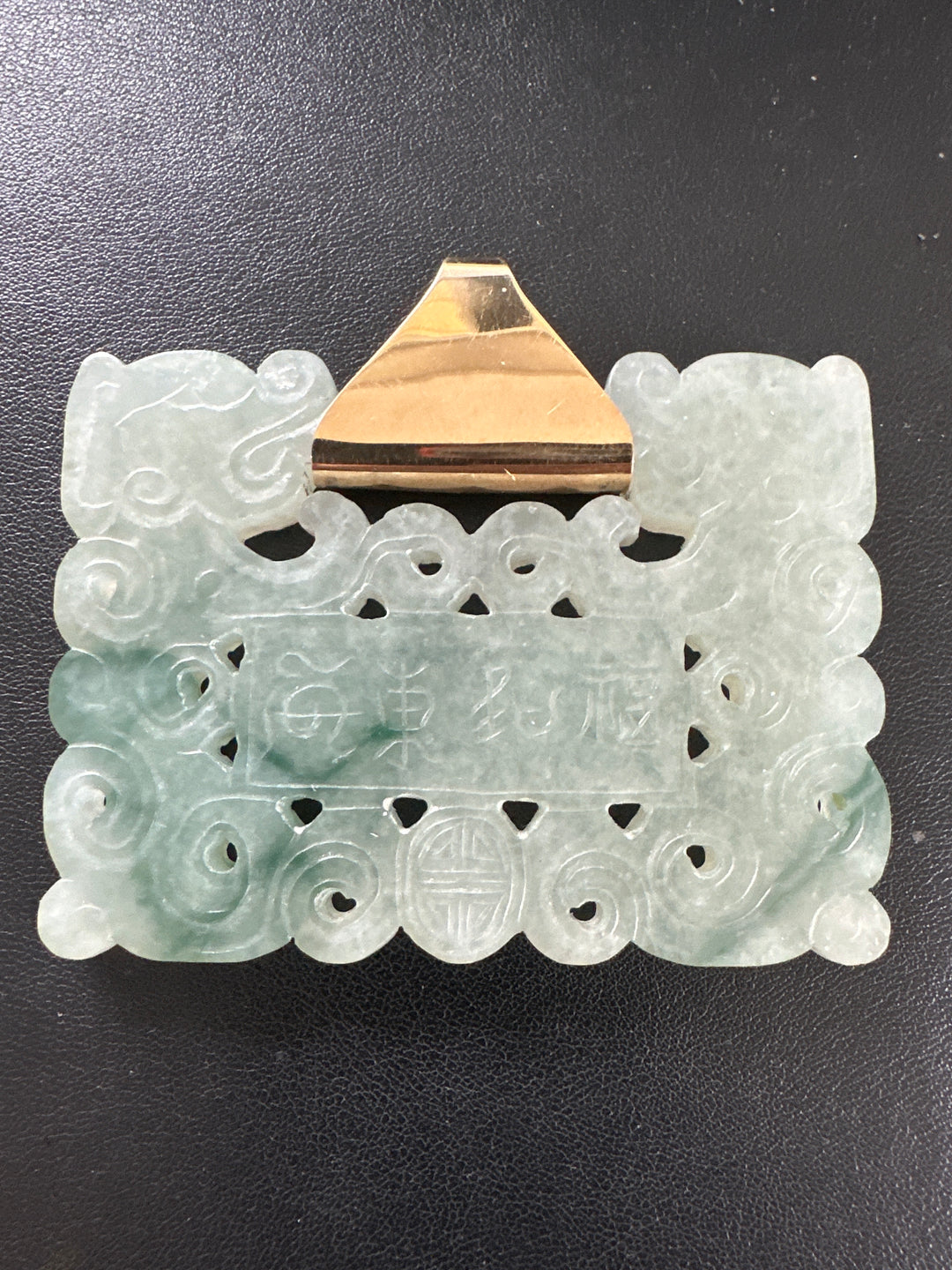 ￼ Lucky 14 karat 91.54 g carved green Jadeite pendant