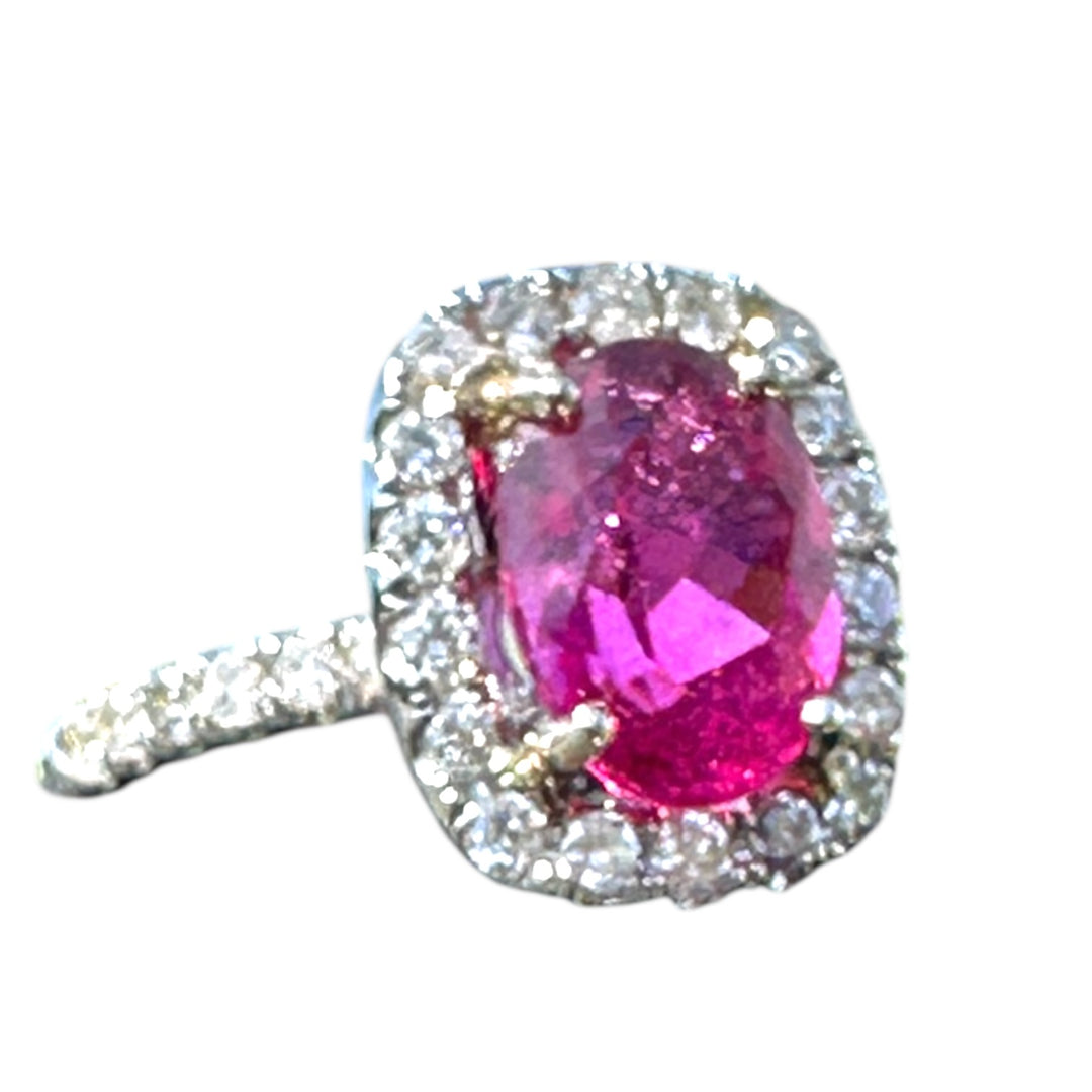 18 karat white gold, 6 carat pink tourmaline and diamond halo ring