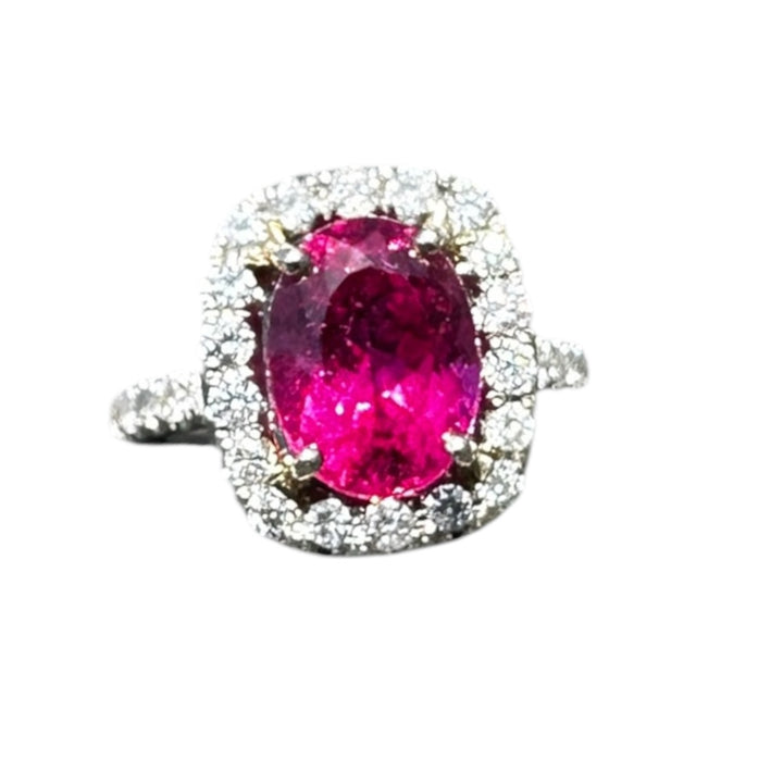 18 karat white gold, 6 carat pink tourmaline and diamond halo ring