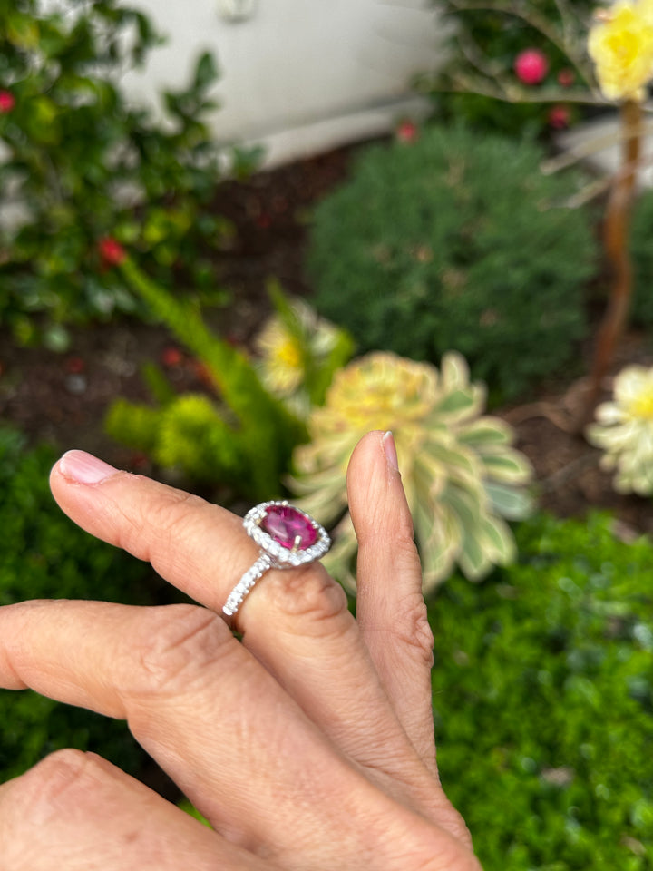 18 karat white gold, 6 carat pink tourmaline and diamond halo ring