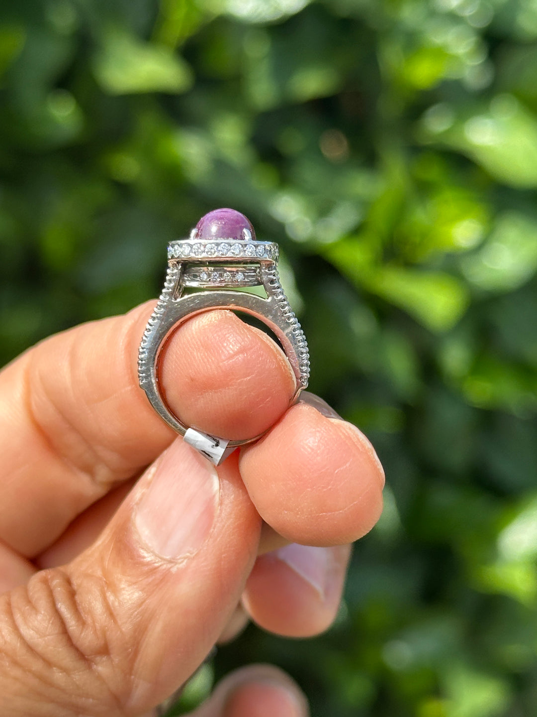 18 karat white gold star ruby halo diamond ring
