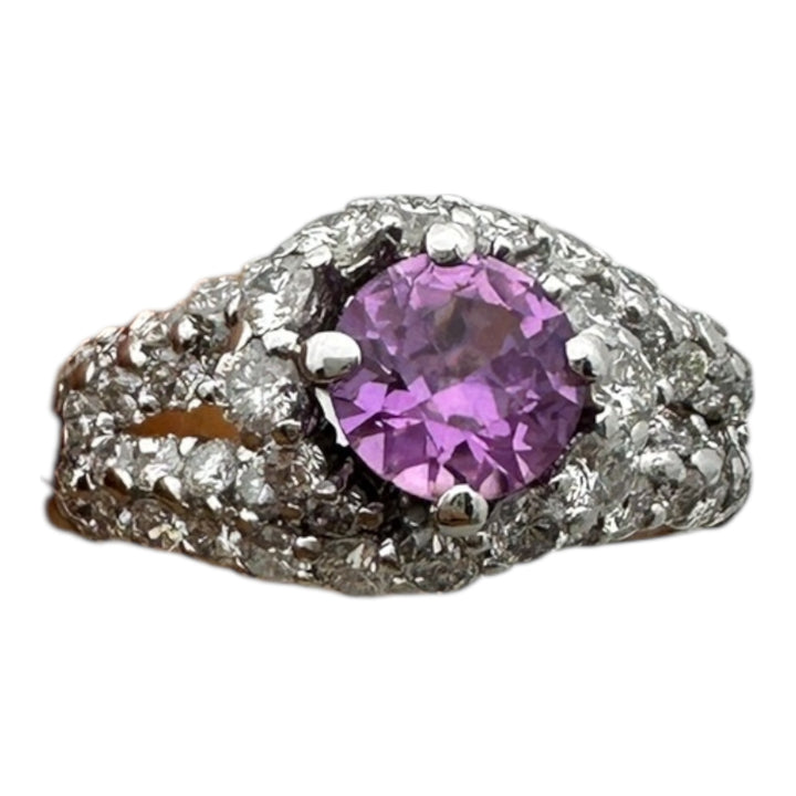 ￼ 14 karat white gold, pink, sapphire, and diamond Paved halo split shank ring