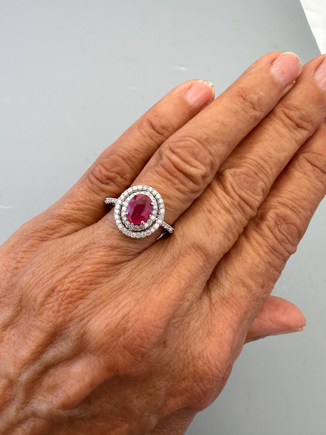 14kt White Gold 1.40 Carat Oval Ruby and Double Diamond Halo Cocktail Ring