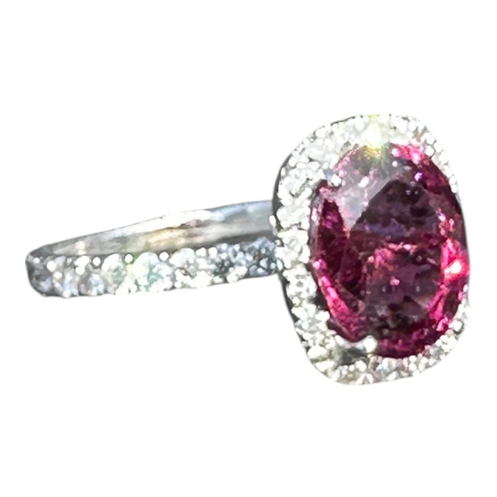 14 karat, 2 carat purple Tourmaline and diamond halo ring