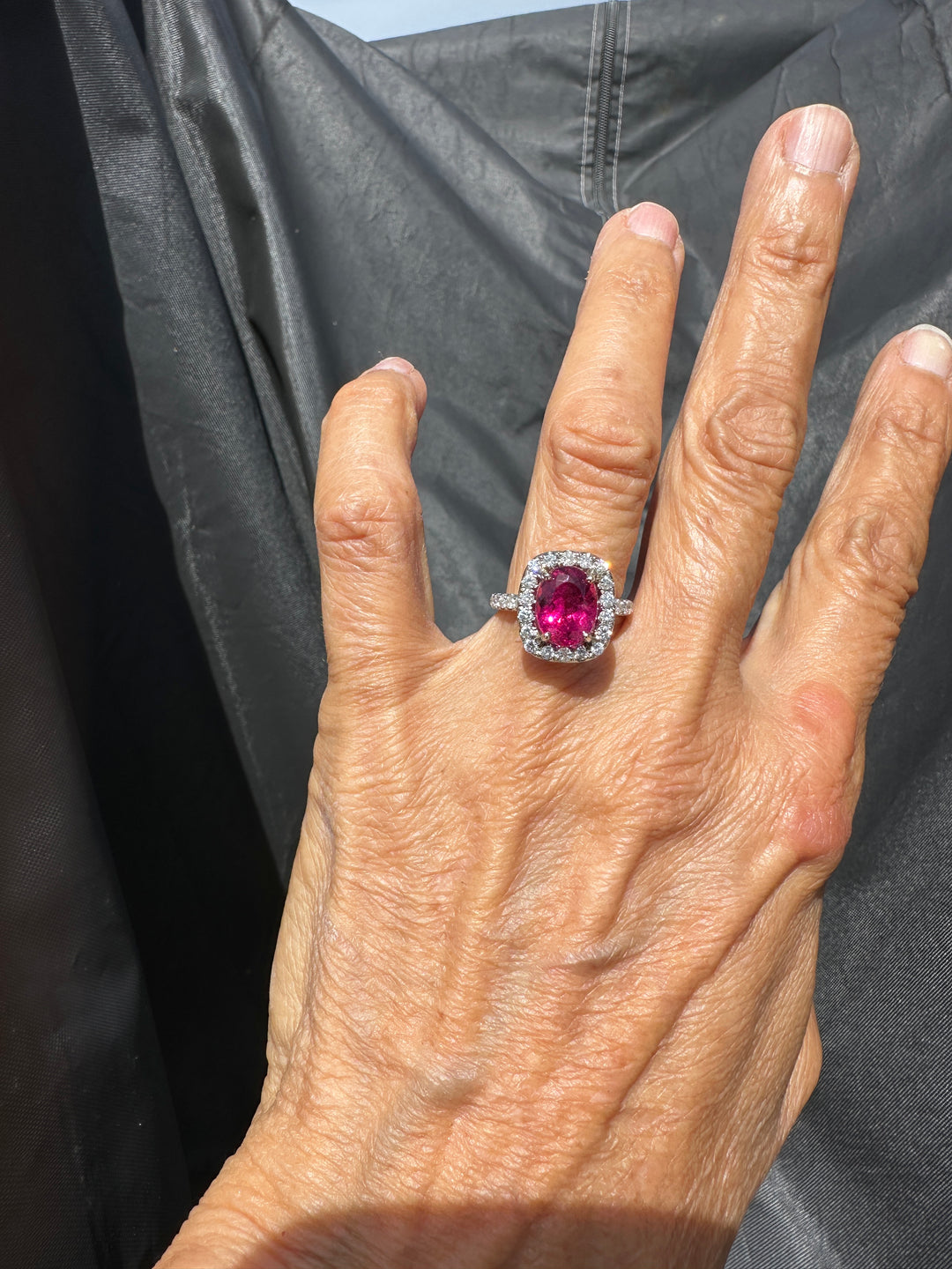 18 karat white gold, 6 carat pink tourmaline and diamond halo ring