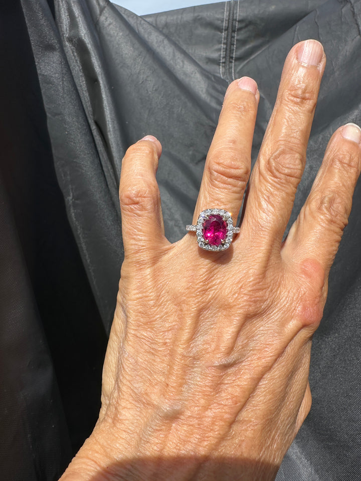 18 karat white gold, 6 carat pink tourmaline and diamond halo ring