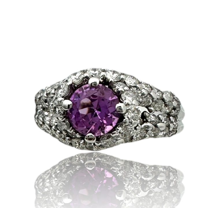 ￼ 14 karat white gold, pink, sapphire, and diamond Paved halo split shank ring