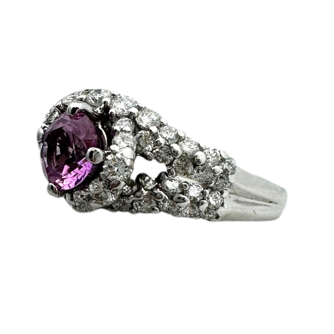 ￼ 14 karat white gold, pink, sapphire, and diamond Paved halo split shank ring