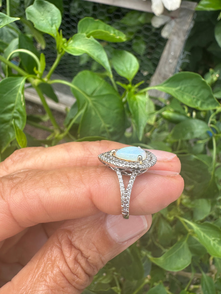 14 karat halo opal ring .80 carat diamond.
