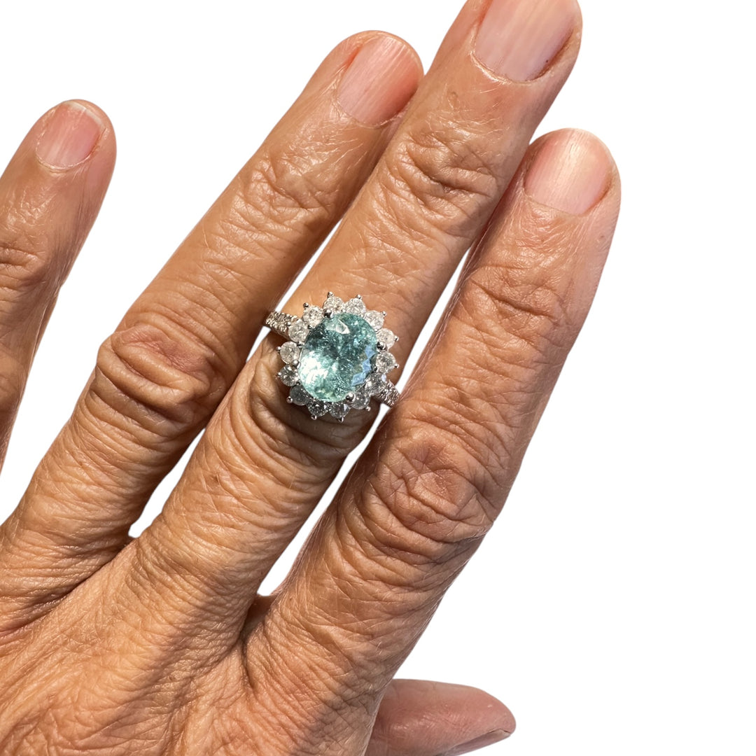 14 karat white gold neon 4.50 Carat Paraiba Tourmaline halo diamond ring