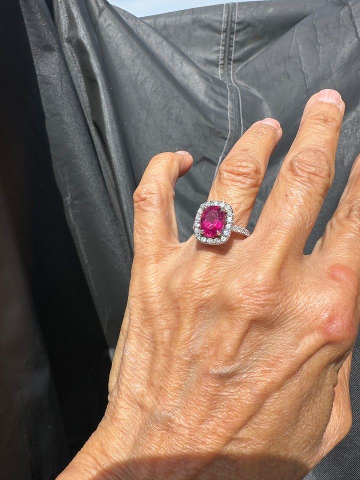 18 karat white gold, 6 carat pink tourmaline and diamond halo ring