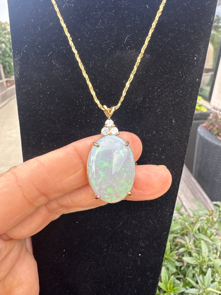 14 karat pendant with 15 karat, Australian opal and diamonds