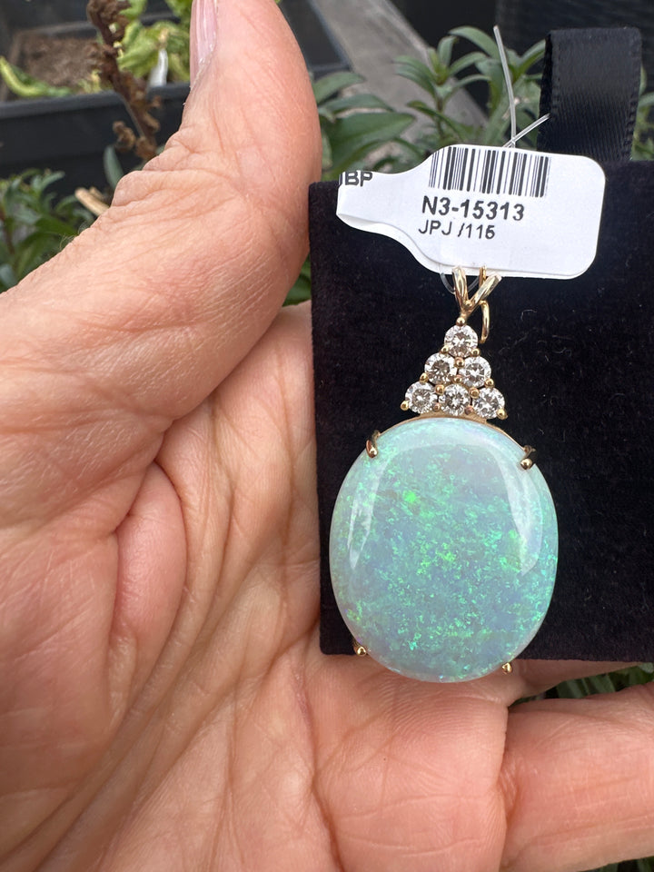 14 karat yellow gold, 22 carat Australian opal .60 karat diamond pendant