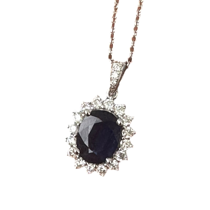 14 karat white gold 2.90 carat sapphire and Diamond Halo, pendant, and chain ￼