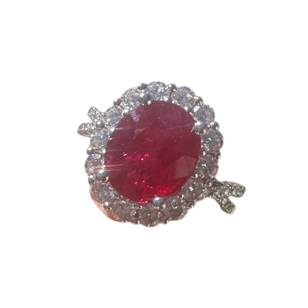 18 karat white gold, 3.58 ct ruby, and diamond halo ring.