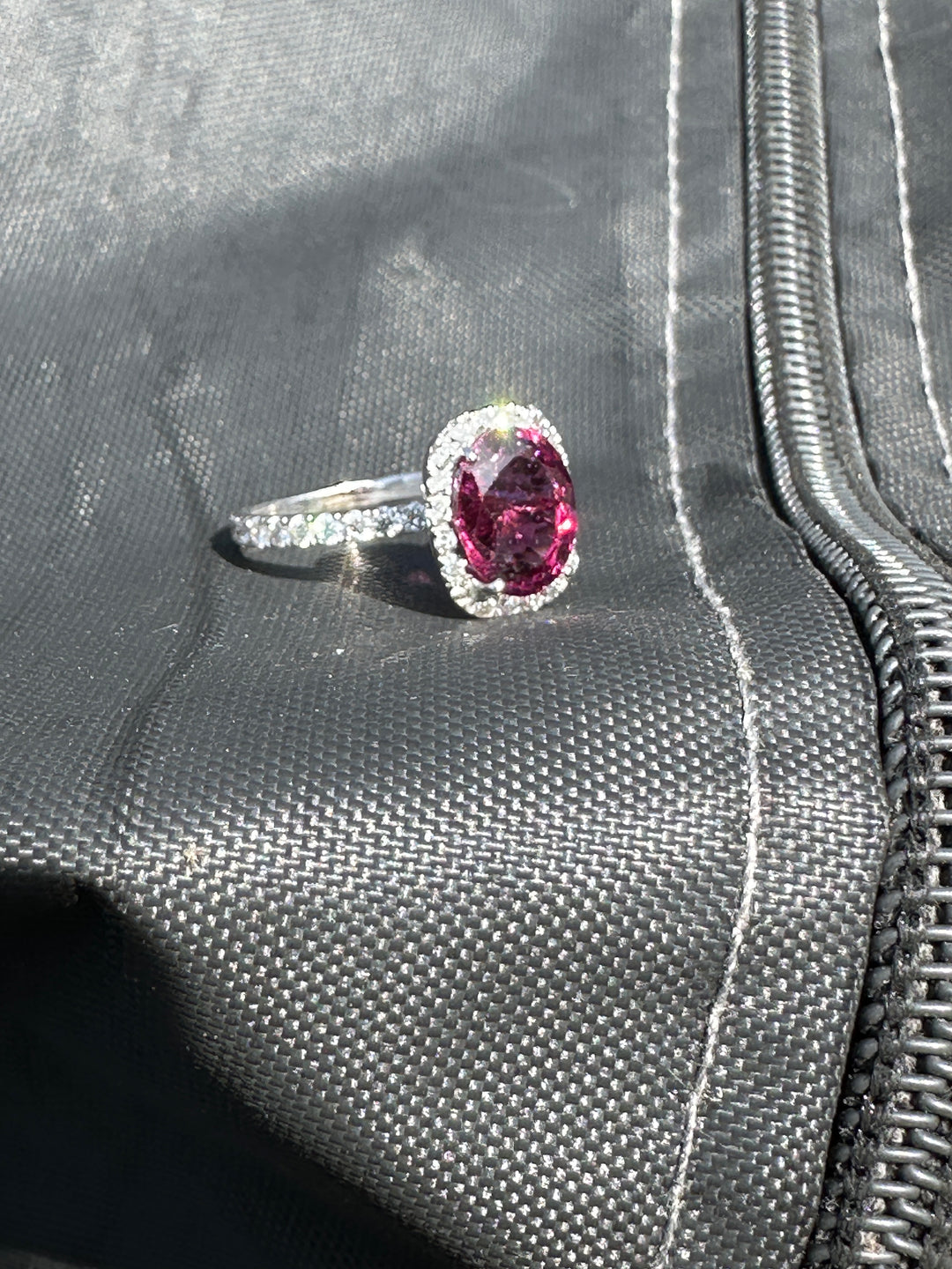 14 karat, 2 carat purple Tourmaline and diamond halo ring