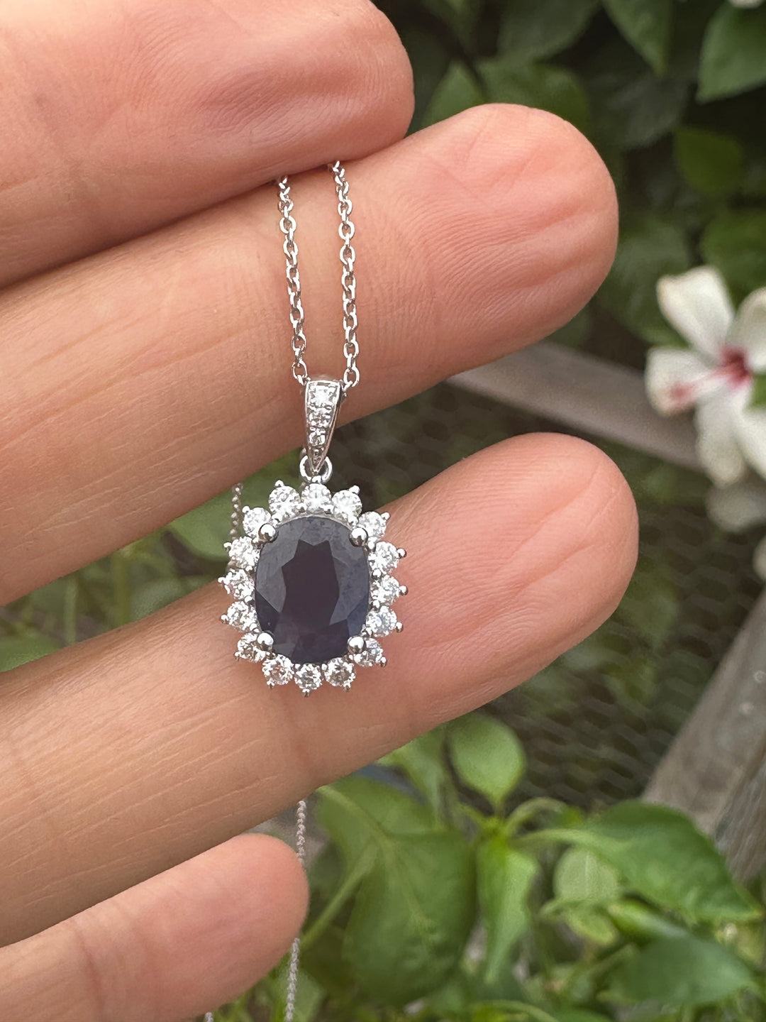 14 karat white gold 2.90 carat sapphire and Diamond Halo, pendant, and chain ￼