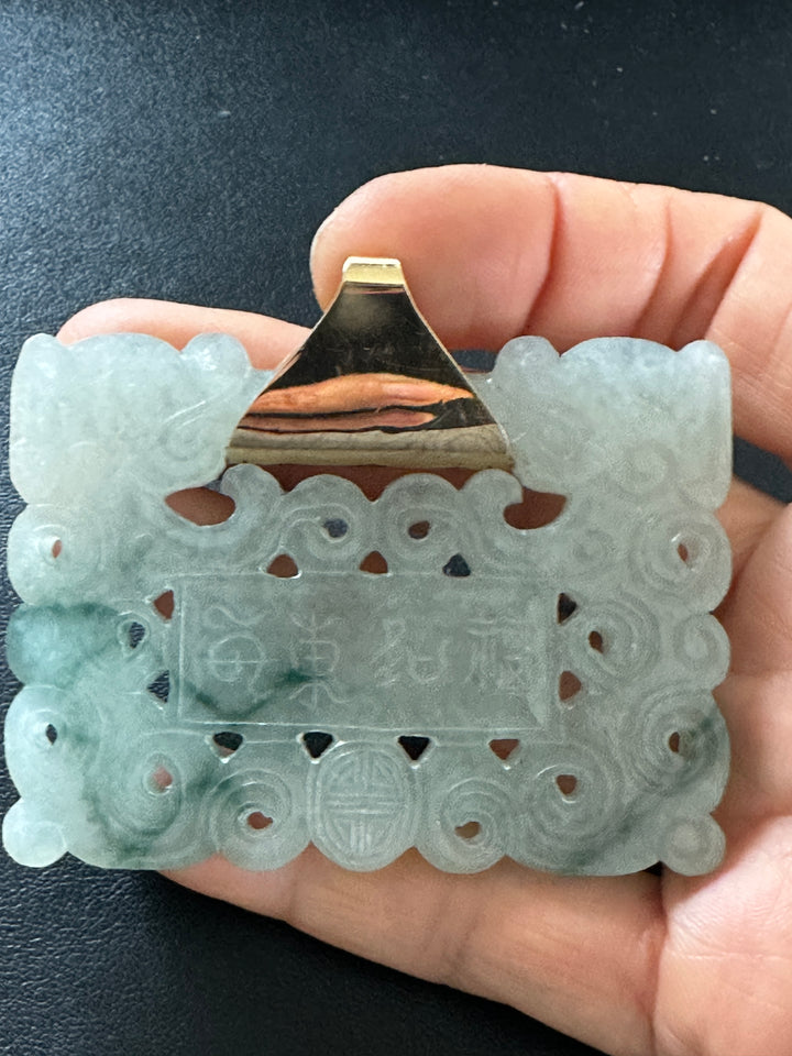 ￼ Lucky 14 karat 91.54 g carved green Jadeite pendant