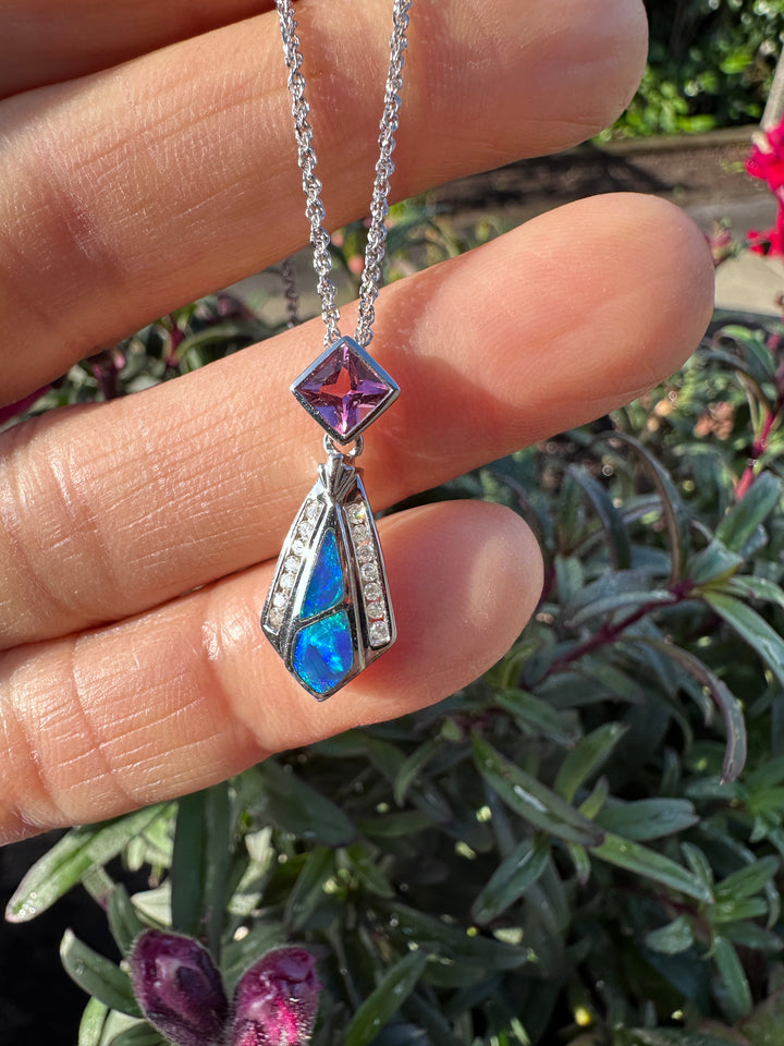 14 karat Opal, tourmaline, and diamond pendant with chain