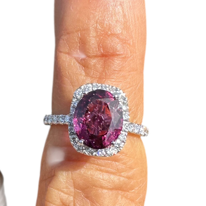 14 karat, 2 carat purple Tourmaline and diamond halo ring