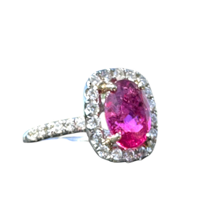 18 karat white gold, 6 carat pink tourmaline and diamond halo ring