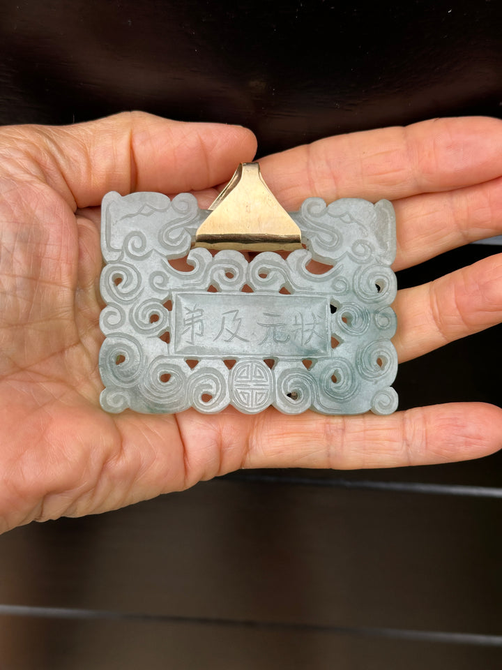 ￼ Lucky 14 karat 91.54 g carved green Jadeite pendant