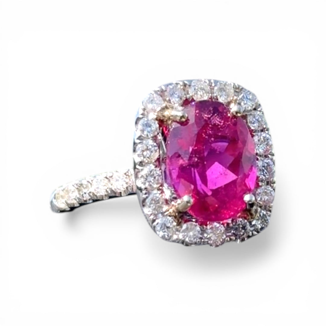 18 karat white gold, 6 carat pink tourmaline and diamond halo ring