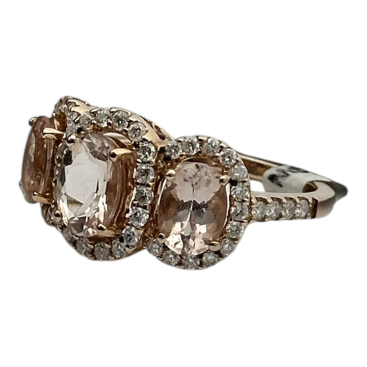 14 karat pink gold, 3-stone Morganite diamond halo ring