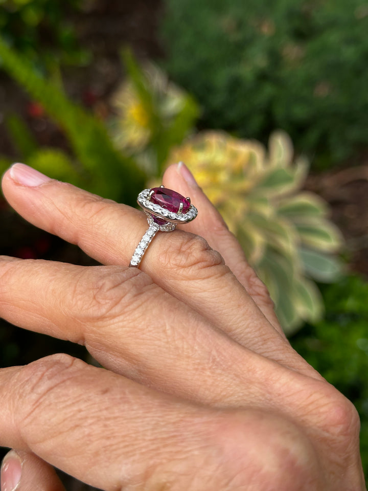 18 karat white gold, 6 carat pink tourmaline and diamond halo ring