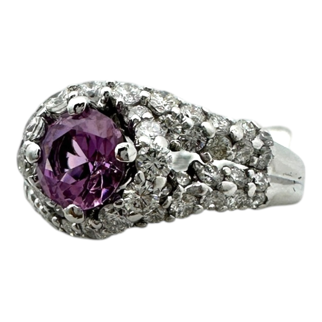 ￼ 14 karat white gold, pink, sapphire, and diamond Paved halo split shank ring