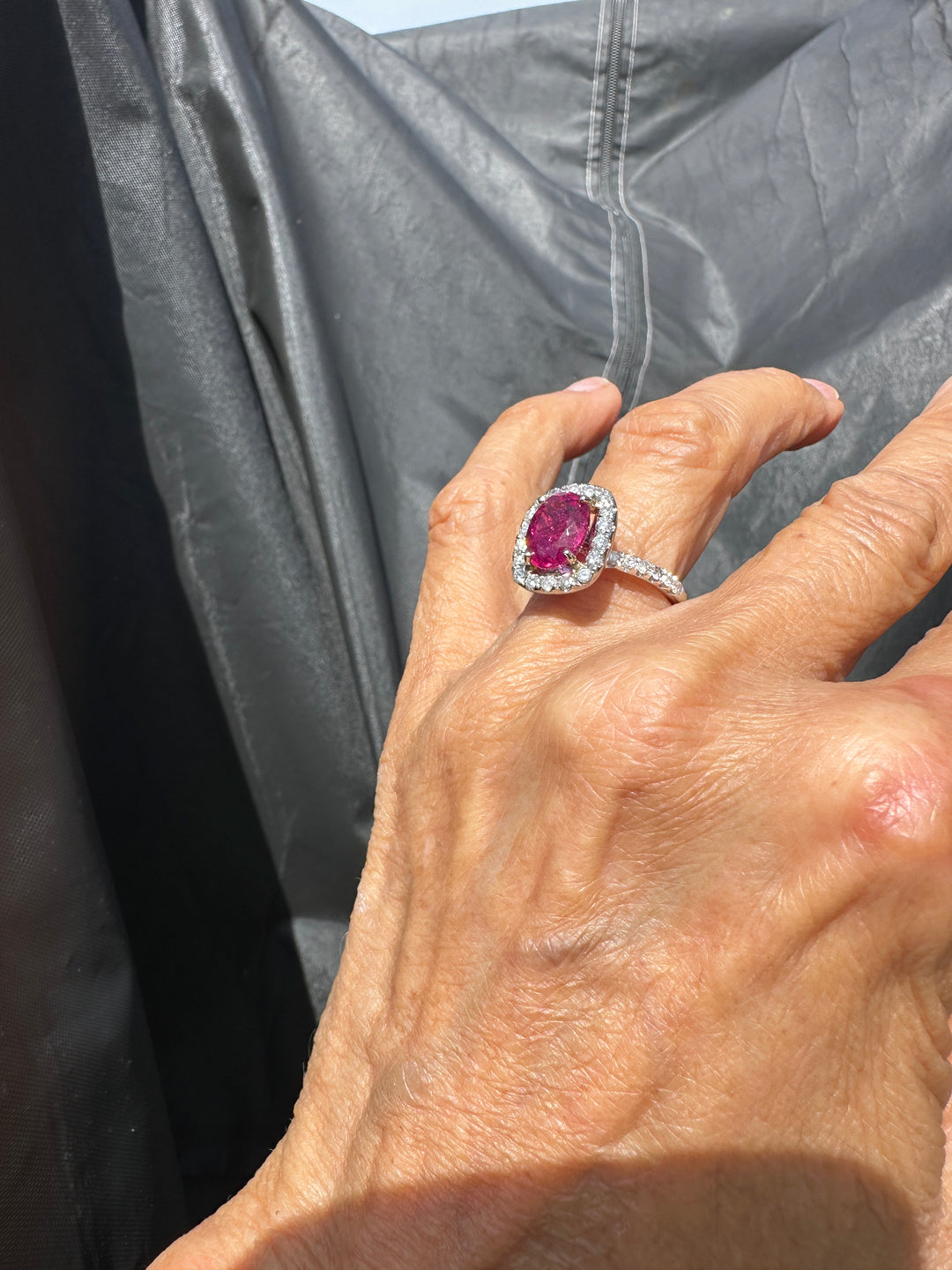 18 karat white gold, 6 carat pink tourmaline and diamond halo ring