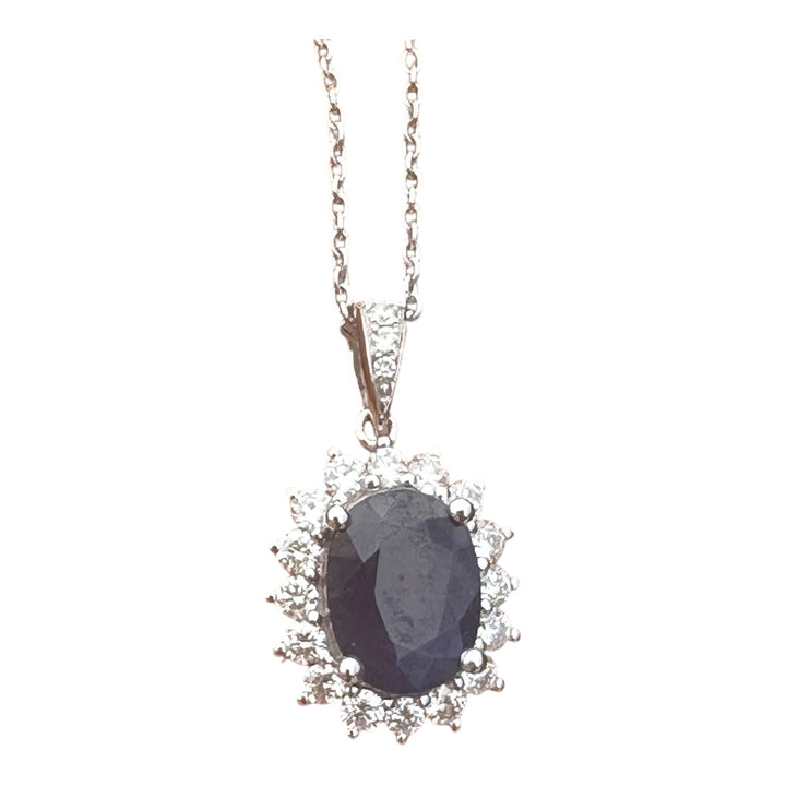 14 karat white gold 2.90 carat sapphire and Diamond Halo, pendant, and chain ￼