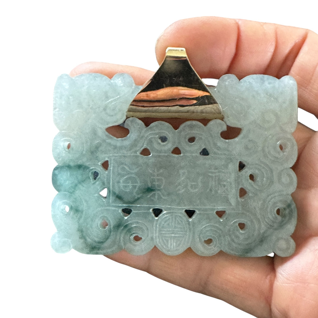 ￼ Lucky 14 karat 91.54 g carved green Jadeite pendant