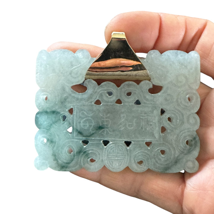 ￼ Lucky 14 karat 91.54 g carved green Jadeite pendant