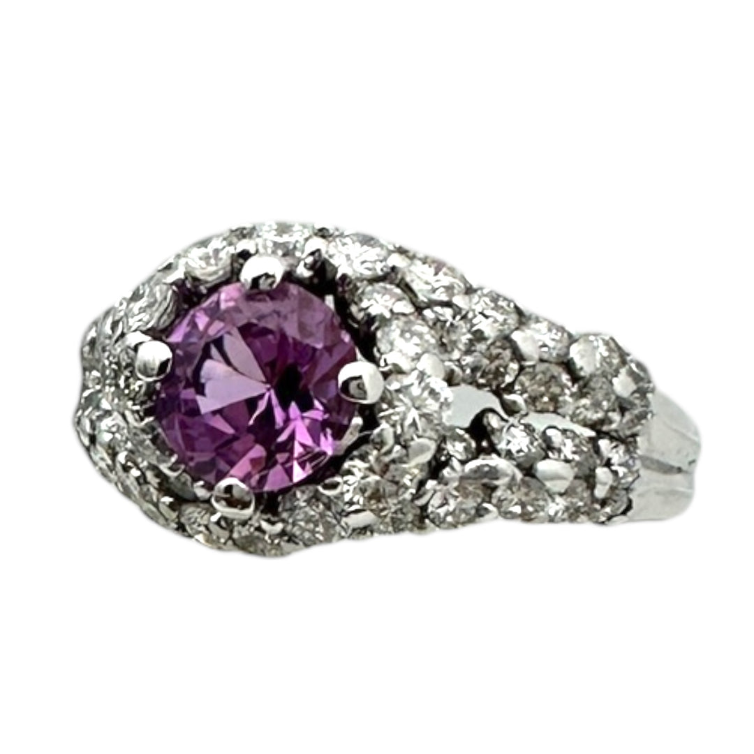 ￼ 14 karat white gold, pink, sapphire, and diamond Paved halo split shank ring