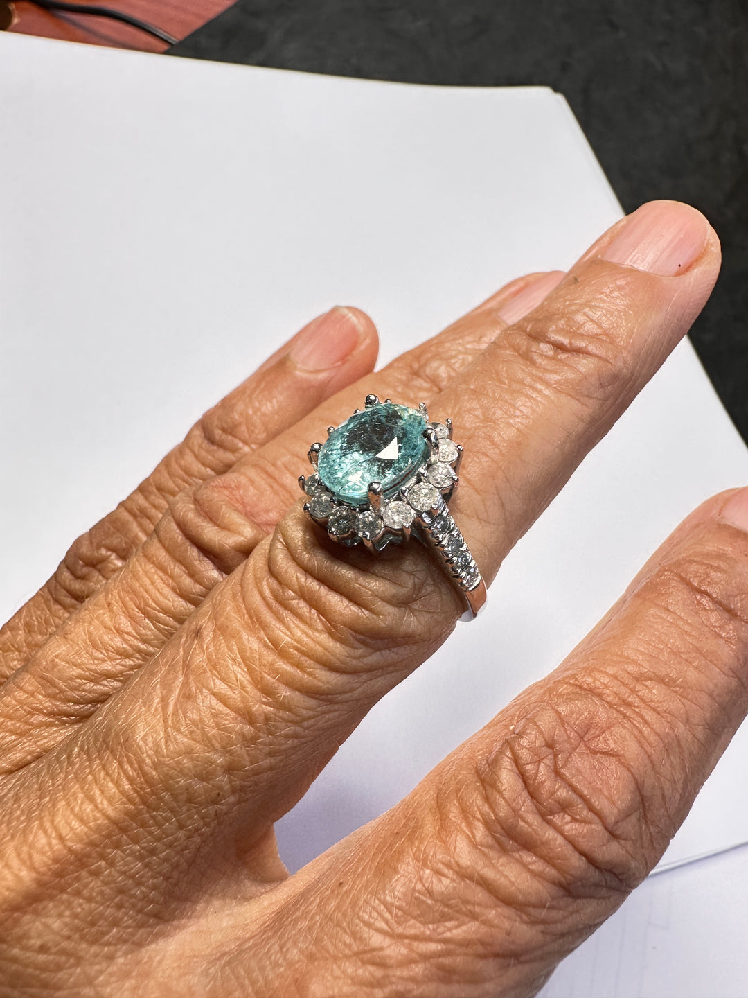14 karat white gold neon 4.50 Carat Paraiba Tourmaline halo diamond ring