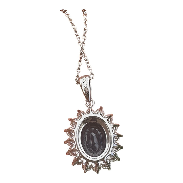 14 karat white gold 2.90 carat sapphire and Diamond Halo, pendant, and chain ￼