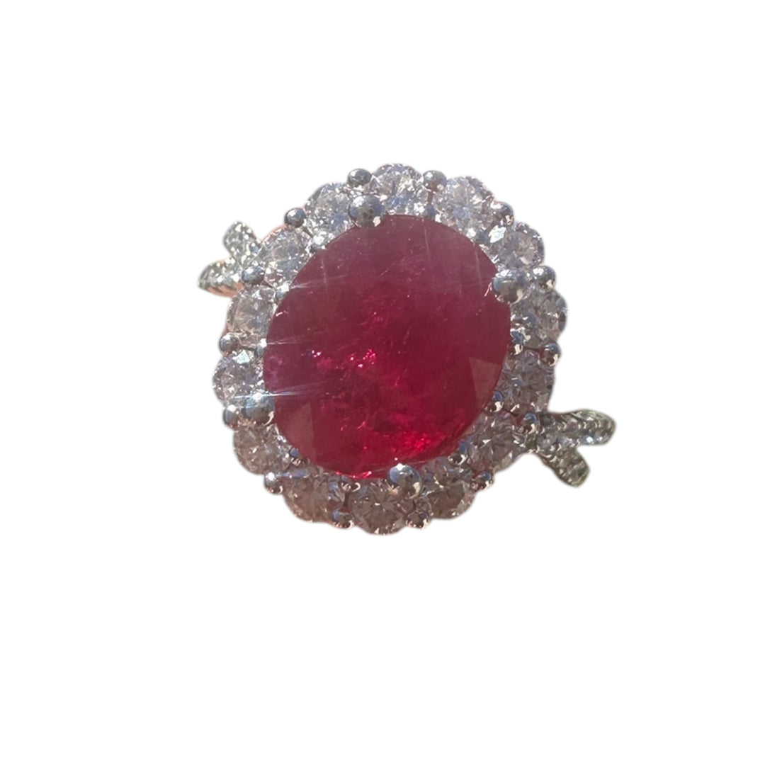 18 karat white gold, 3.58 ct ruby, and diamond halo ring.