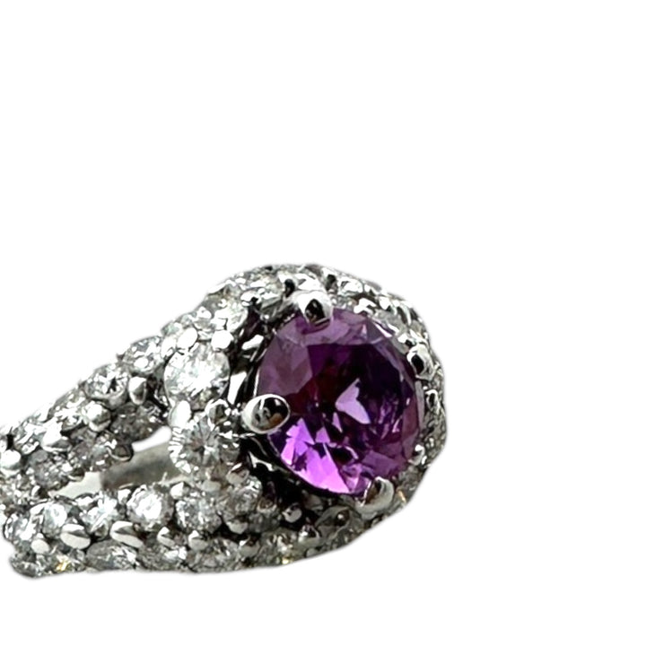 ￼ 14 karat white gold, pink, sapphire, and diamond Paved halo split shank ring